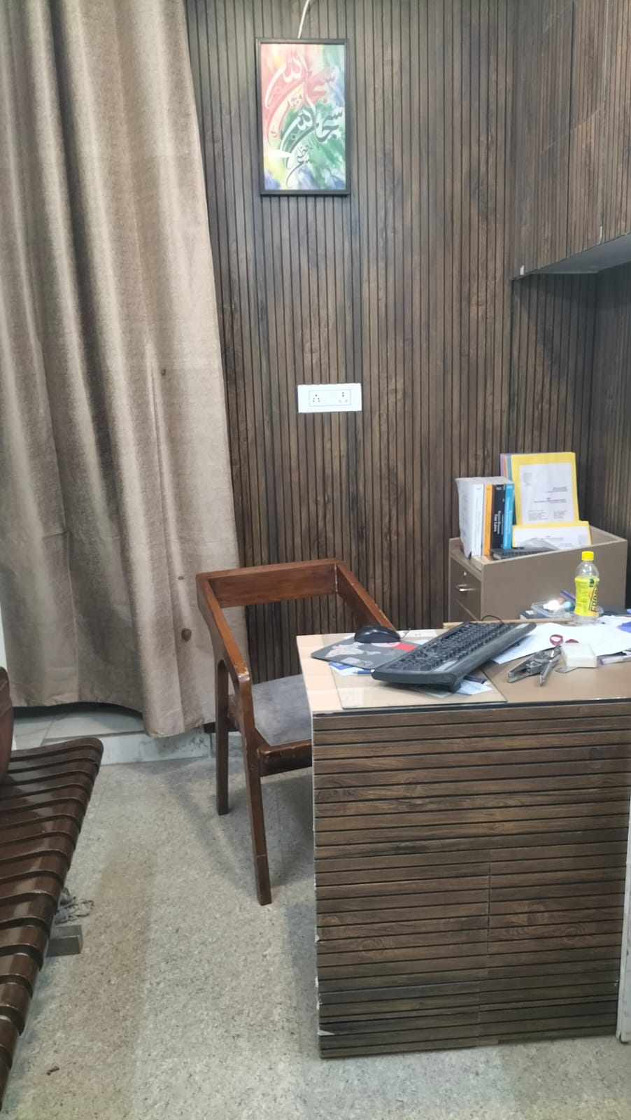 Mr. Junaid Alam Khan at his desk, Taj Legal & Tax Consultancy